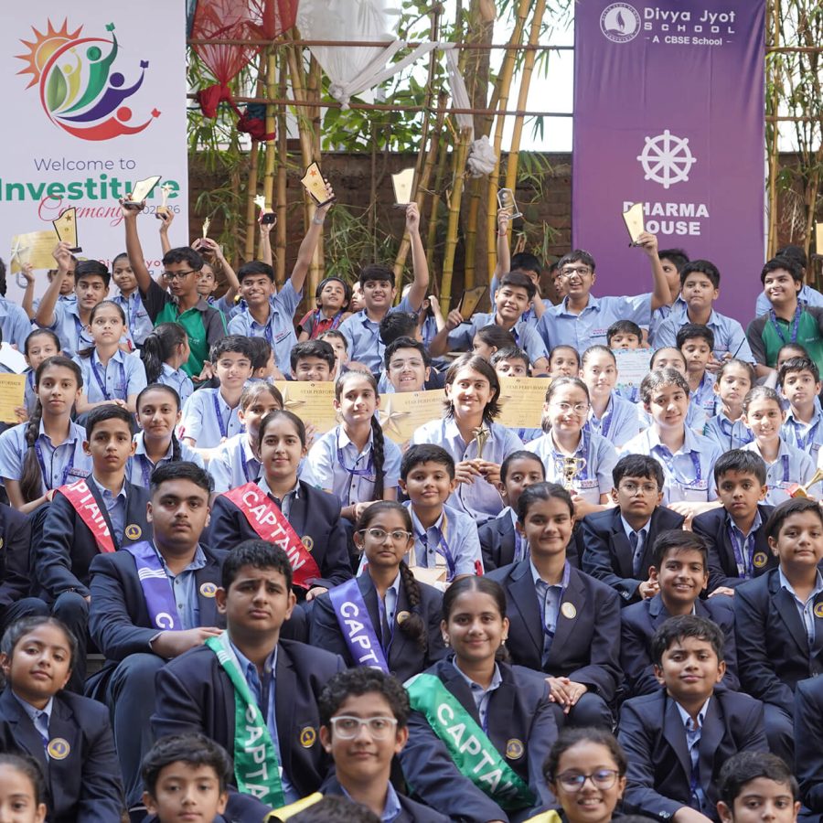 Group photo of school students in uniform holding certificates at an award ceremony event